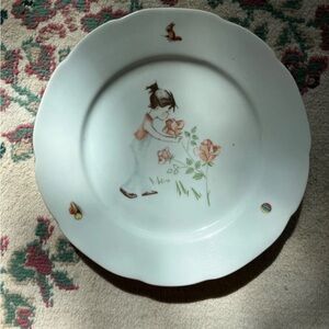 Vintage porcelain plate with girl